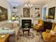 Cozy living room featuring a fireplace, built-in bookshelves, and comfortable seating at 1976 Holy Cow Rd, Polk City, FL 33868