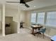 This well-lit living room features light walls, carpet flooring, and plenty of natural light at 1976 Holy Cow Rd, Polk City, FL 33868