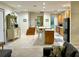 Open-concept living area features a kitchen island, and neutral tones, creating an inviting space at 1976 Holy Cow Rd, Polk City, FL 33868