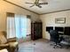 Bright office space with neutral tones, large window, and comfortable seating at 1976 Holy Cow Rd, Polk City, FL 33868