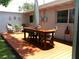 Outdoor deck featuring a wooden table with seating for outdoor dining and enjoying the backyard views at 2021 Oliver Pl, Winter Haven, FL 33881