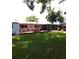 This backyard is designed for relaxation with a spacious deck for dining or lounging and a screened in porch at 2021 Oliver Pl, Winter Haven, FL 33881