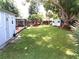 Spacious backyard with shade trees, chicken coop and shed at 2021 Oliver Pl, Winter Haven, FL 33881