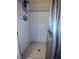Bathroom featuring a shower with white tile surround, hexagon-tiled floor, and updated fixtures at 2021 Oliver Pl, Winter Haven, FL 33881