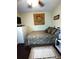 Comfortable bedroom with ceiling fan, hard floors, and natural light at 2021 Oliver Pl, Winter Haven, FL 33881