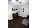 Bedroom featuring wood-look flooring, closet space, desk and a cozy lounge area at 2021 Oliver Pl, Winter Haven, FL 33881
