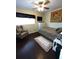 Inviting bedroom featuring a cozy armchair, TV, and natural light at 2021 Oliver Pl, Winter Haven, FL 33881