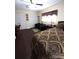 Bedroom with wood-look floors, closet space, and natural light creating a welcoming atmosphere at 2021 Oliver Pl, Winter Haven, FL 33881