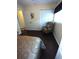 Bedroom featuring a striped armchair, closet, and natural light at 2021 Oliver Pl, Winter Haven, FL 33881