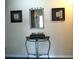 Inviting entryway featuring a decorative table and mirror at 2021 Oliver Pl, Winter Haven, FL 33881
