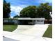 Charming single story home with a well-maintained lawn and covered parking at 2021 Oliver Pl, Winter Haven, FL 33881