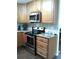 Cozy kitchen featuring stainless steel appliances and light countertops at 2021 Oliver Pl, Winter Haven, FL 33881