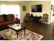 Open concept living room with hardwood floors and comfortable seating at 2021 Oliver Pl, Winter Haven, FL 33881
