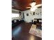 Relaxing living room with wood ceiling, comfortable sofa, and vintage accents at 2021 Oliver Pl, Winter Haven, FL 33881