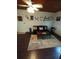 Cozy living room with rustic decor and ceiling fan at 2021 Oliver Pl, Winter Haven, FL 33881
