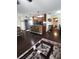 Inviting open-concept living room featuring dark wood floors and cozy breakfast bar seating at 2021 Oliver Pl, Winter Haven, FL 33881