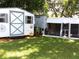 View of the storage shed, chicken coop, and chicken at 2021 Oliver Pl, Winter Haven, FL 33881