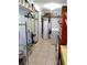 Organized utility room with shelving, cleaning supplies, and washer-dryer at 2021 Oliver Pl, Winter Haven, FL 33881