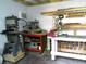 The workshop features an array of power tools, workbenches, and well-lit space for completing various projects at 2021 Oliver Pl, Winter Haven, FL 33881