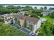 A lovely condominium with a pool is displayed from above, with gorgeous, mature surrounding landscaping, and easy parking at 2037 San Marcos Se Dr # 443, Winter Haven, FL 33880