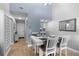 Dining area adjacent to the entryway and kitchen featuring bright light, and seating for four at 2037 San Marcos Se Dr # 443, Winter Haven, FL 33880