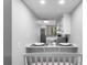 Cozy dining area featuring an eat-in counter, white cabinets, stainless steel appliances, and plenty of light at 2037 San Marcos Se Dr # 443, Winter Haven, FL 33880