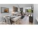Open-concept dining and living area with modern decor, comfortable seating, and bright, natural light at 2037 San Marcos Se Dr # 443, Winter Haven, FL 33880