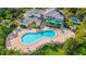 Aerial shot of a resort showcasing a pool, jacuzzi, and various amenities at 209 Andros Ave # 15301, Davenport, FL 33897