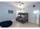 A bedroom that includes a wooden bunk bed, bean bag chair and decor at 209 Andros Ave # 15301, Davenport, FL 33897