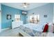 Comfortable bedroom featuring a ceiling fan, large dresser, and access to an outdoor balcony at 209 Andros Ave # 15301, Davenport, FL 33897