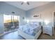 Bright bedroom with balcony access, featuring a comfortable bed and soft, natural light at 209 Andros Ave # 15301, Davenport, FL 33897