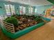 Bright community space featuring an indoor pond surrounded by lush greenery at 209 Andros Ave # 15301, Davenport, FL 33897