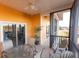 Covered patio with seating area perfect for entertaining at 209 Andros Ave # 15301, Davenport, FL 33897