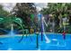 Colorful water park area with frog-shaped sprinklers for splashing fun, plus bucket drops and a kid-friendly fire hydrant at 209 Andros Ave # 15301, Davenport, FL 33897