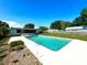 Backyard in-ground pool with clean lines, ladder, and patio deck at 2159 Greenway Dr, Winter Haven, FL 33881