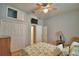 Bedroom with ceiling fan, hardwood floors, and a double door closet at 2252 Fox Run Rd, Lake Wales, FL 33898