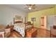Spacious bedroom features a four poster bed and en suite bathroom access at 2252 Fox Run Rd, Lake Wales, FL 33898