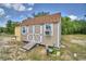 View of a shed with white trim and an air conditioning unit at 2252 Fox Run Rd, Lake Wales, FL 33898