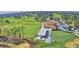 Wide aerial shot of the golf course, clubhouse, and driving range at 2350 Paulette Dr, Haines City, FL 33844
