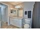 Bathroom with a gray shower curtain and tile floors, leading to other rooms at 2350 Paulette Dr, Haines City, FL 33844