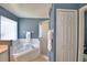 Bathroom with a soaking tub and a shower enclosure at 2350 Paulette Dr, Haines City, FL 33844