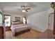 Comfortable bedroom with ceiling fan, carpet and natural light at 2350 Paulette Dr, Haines City, FL 33844