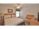 Cozy bedroom with a ceiling fan, a desk, and neutral decor at 2350 Paulette Dr, Haines City, FL 33844
