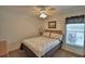 Cozy bedroom with natural light and a comfortable, patterned bedspread at 2350 Paulette Dr, Haines City, FL 33844