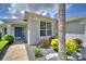Attractive home exterior with palm tree and meticulously maintained landscaping at 2350 Paulette Dr, Haines City, FL 33844