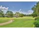 Expansive golf course view highlighting lush greenery, mature trees, and serene community living at 2350 Paulette Dr, Haines City, FL 33844