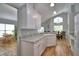 Well-lit kitchen featuring white cabinets and granite countertops at 2350 Paulette Dr, Haines City, FL 33844