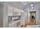 Functional kitchen featuring white appliances and cabinetry at 2350 Paulette Dr, Haines City, FL 33844