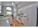Bright kitchen showcases white appliances, granite counters, and an arch window at 2350 Paulette Dr, Haines City, FL 33844