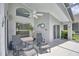 Covered lanai features ceiling fan and plenty of seating at 2350 Paulette Dr, Haines City, FL 33844